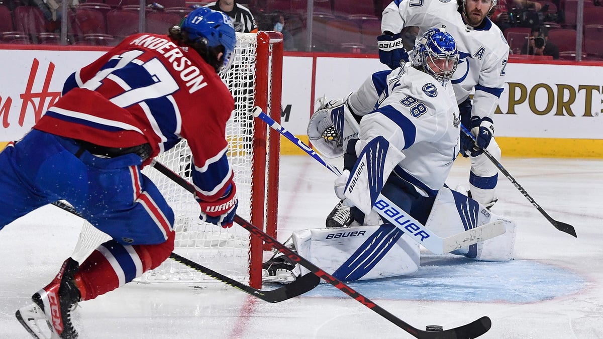 Montreal Canadiens right wing Josh Anderson (17) shoots and scores against Tampa Bay Lightning goaltender Andrei Vasilevskiy (88) during the overtime period in game four of the 2021 Stanley Cup Final on July 5, 2021, at the Bell Centre in Montreal.