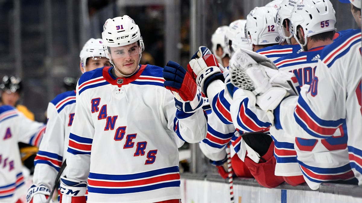 New York Rangers left wing Sammy Blais (91) celebrates with his teammates after scoring a goal against the Boston Bruins during the first period Oct. 2, 2021, at the TD Garden in Boston.