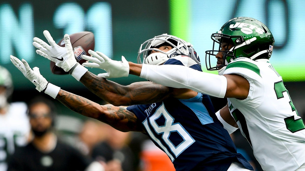 New York Jets cornerback Bryce Hall (37) breaks up a pass intended for Tennessee Titans wide receiver Josh Reynolds (18) during the third quarter at MetLife Stadium Sunday, Oct. 3, 2021 in East Rutherford, N.J. 