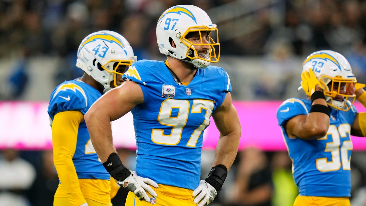 Oct 4, 2021; Inglewood, California, USA; Los Angeles Chargers defensive end Joey Bosa (97) waits at the line with cornerback Michael Davis (43) and safety Alohi Gilman (32) during the first half against the Las Vegas Raiders at SoFi Stadium. Mandatory Credit: Robert Hanashiro-USA TODAY Sports