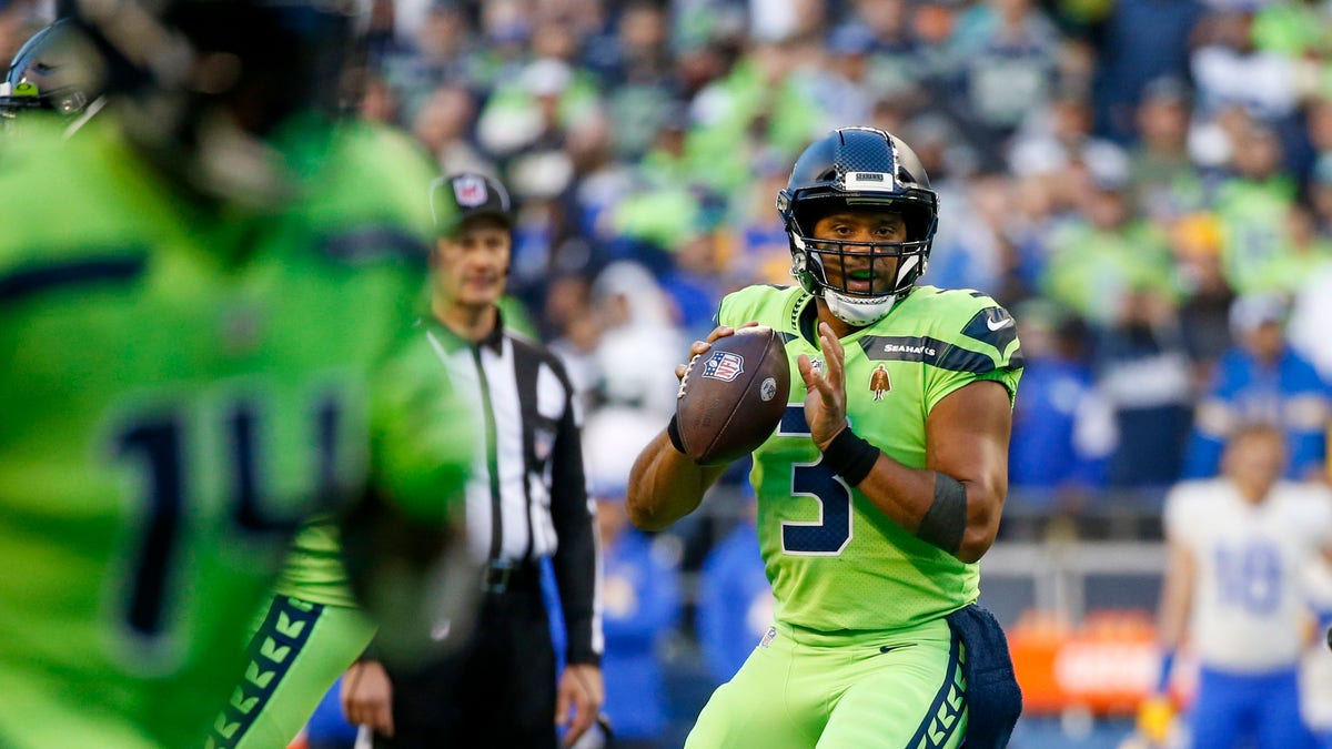 Seattle Seahawks quarterback Russell Wilson (3) looks to pass against the Los Angeles Rams during the second quarter at Lumen Field.