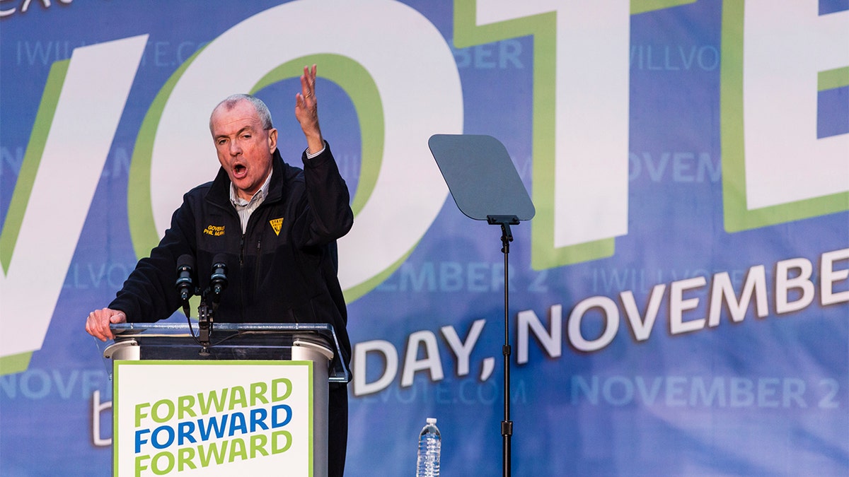 Gov. Phil Murphy speaks at an early vote rally at Weequahic Park, Saturday, Oct. 23, 2021, in Newark, N.J. (AP Photo/Stefan Jeremiah)