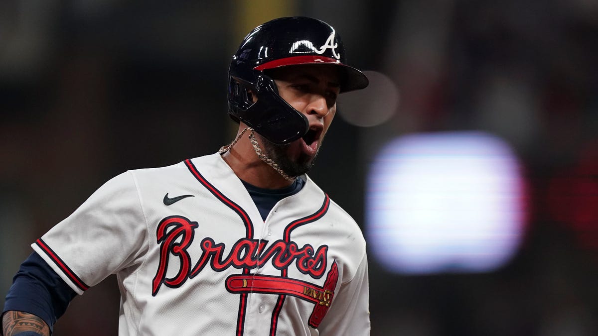 Atlanta Braves' Eddie Rosario celebrates after hitting a three run home run during the fourth inning in Game 6 of baseball's National League Championship Series against the Los Angeles Dodgers Saturday, Oct. 23, 2021, in Atlanta.