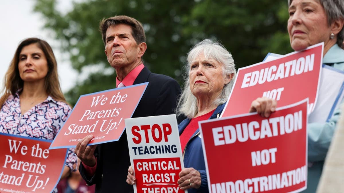 Opponents of the academic doctrine known as critical race theory protest outside the Loudoun County School Board headquarters, in Ashburn, Virginia, June 22, 2021. 