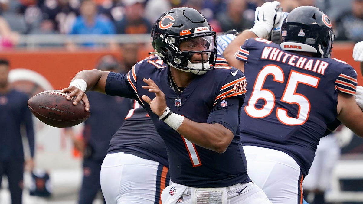 Chicago Bears quarterback Justin Fields passes during the first half of an NFL football game against the Detroit Lions Sunday, Oct. 3, 2021, in Chicago. 