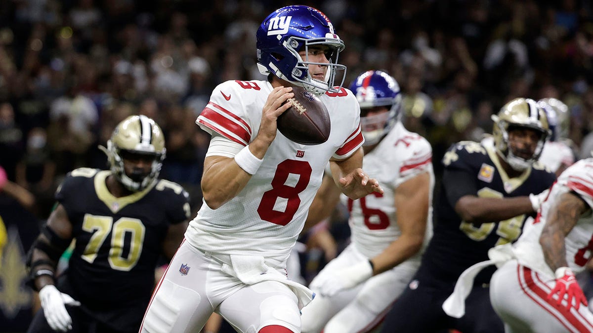 New York Giants quarterback Daniel Jones (8) scrambles in the first half of an NFL football game against the New Orleans Saints in New Orleans, Sunday, Oct. 3, 2021.