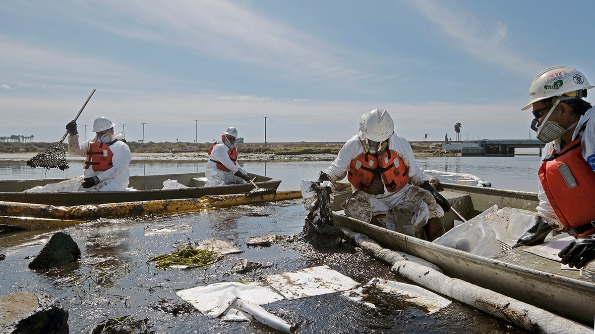 Crew cleaning up oil spill
