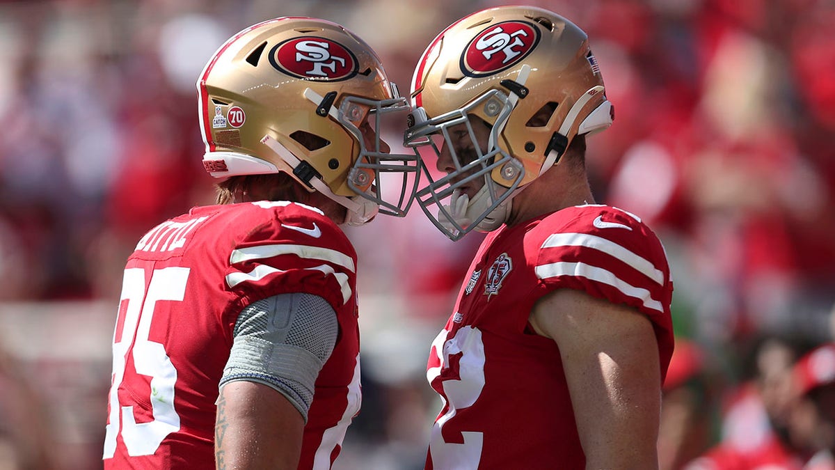 San Francisco 49ers tight end Ross Dwelley, right, is congratulated by George Kittle after catching a touchdown pass against the Seattle Seahawks during the first half of a game in Santa Clara, Calif., Sunday, Oct. 3, 2021.