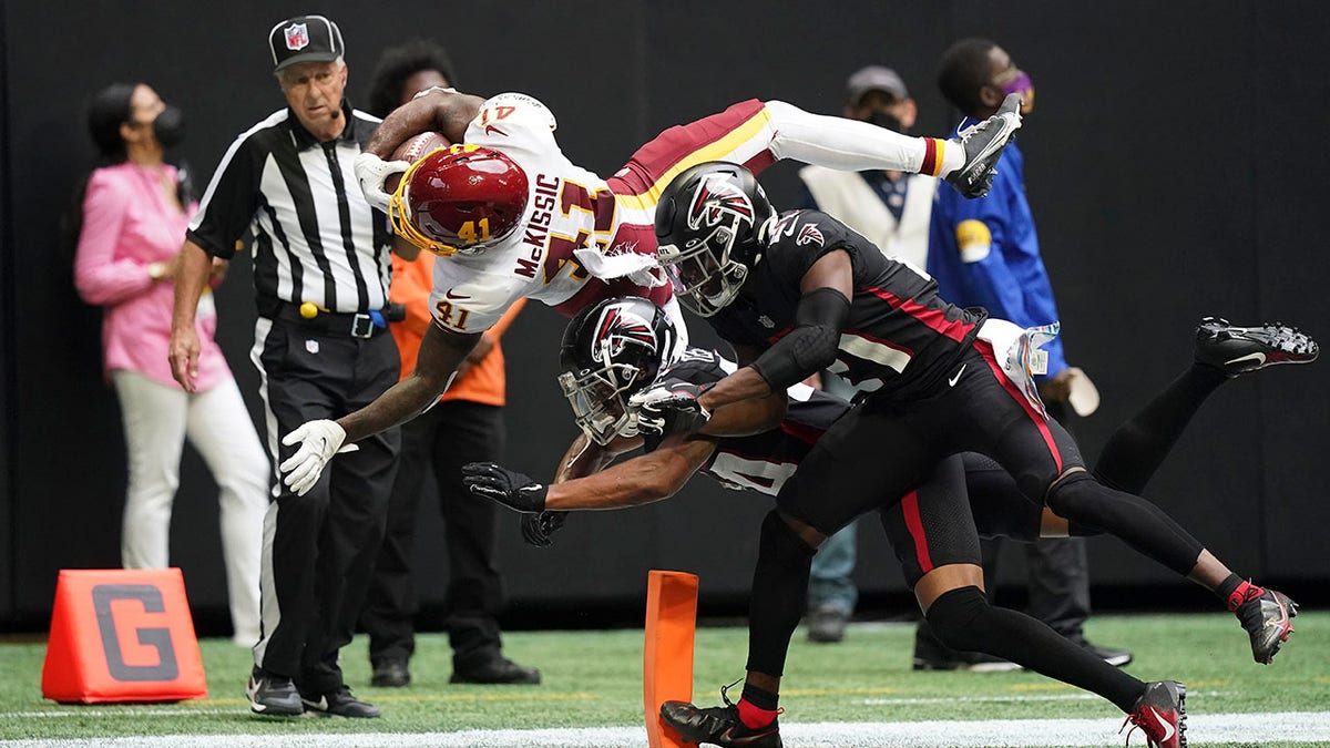 Washington Football Team running back J.D. McKissic (41) dives toward the end zone for a touchdown against the Atlanta Falcons during the second half of an NFL football game, Sunday, Oct. 3, 2021, in Atlanta. The Washington Football Team won 34-30.