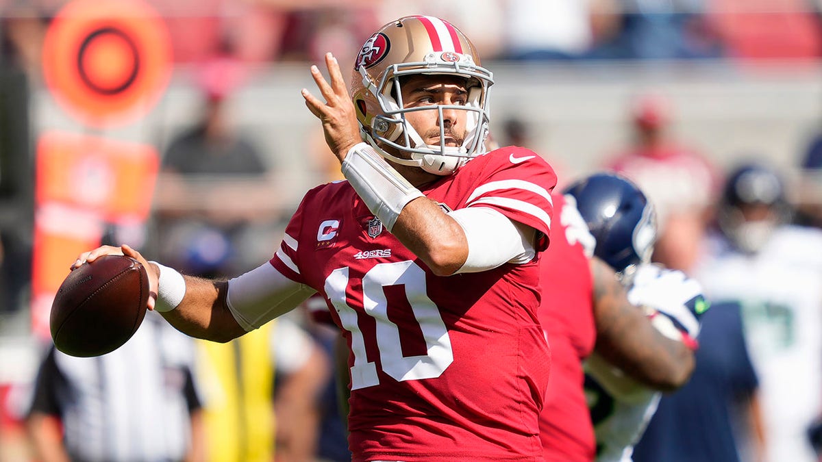 San Francisco 49ers quarterback Jimmy Garoppolo (10) passes against the Seattle Seahawks during the first half of an NFL football game in Santa Clara, Calif., Sunday, Oct. 3, 2021.