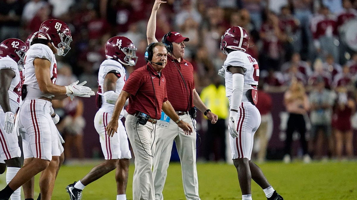 Alabama coach Nick Saban calls to players during a timeout in the first half of an NCAA college football game against Texas A&amp;amp;M on Saturday, Oct. 9, 2021, in College Station, Texas. (AP Photo/Sam Craft)