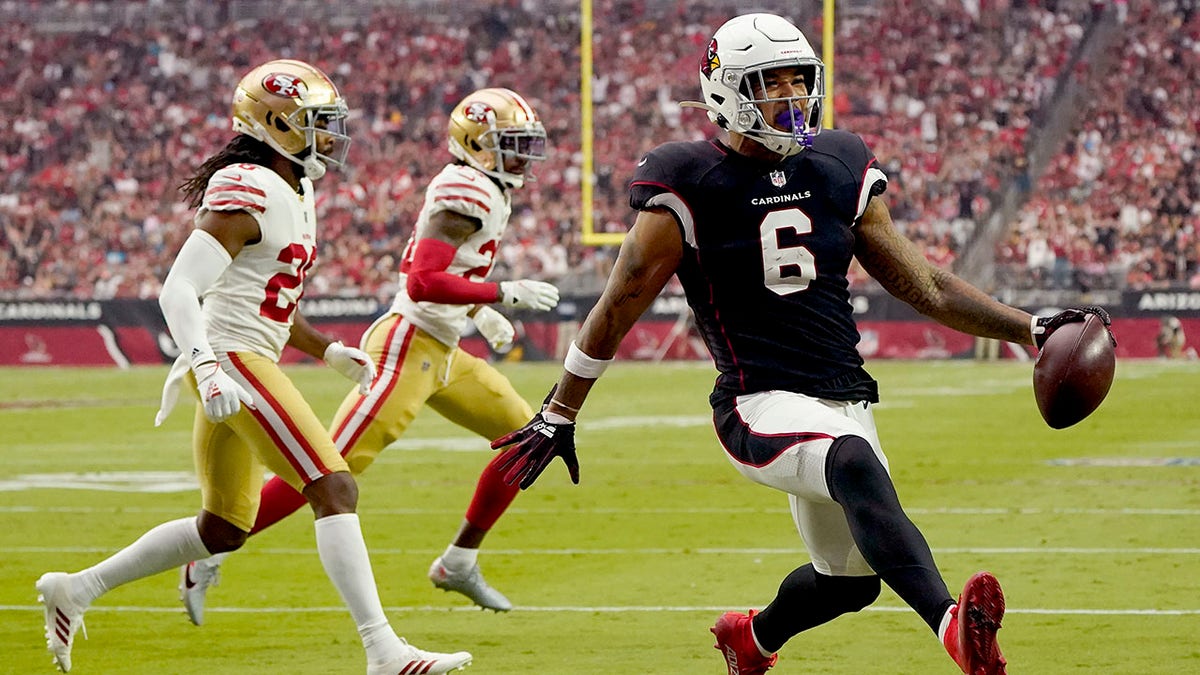 Arizona Cardinals running back James Conner (6) scores a touchdown against the San Francisco 49ers during the first half of an NFL football game, Sunday, Oct. 10, 2021, in Glendale, Arizona. 