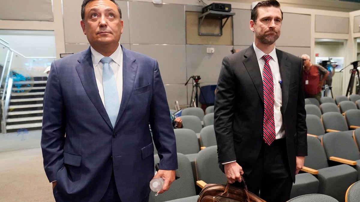 Miami police Chief Art Acevedo and his attorney John R. Byrne, arrive at Miami City Hall on Thursday for a hearing to determine his job. Acevedo was suspended after a tumultuous six-month tenure and fired Thursday.