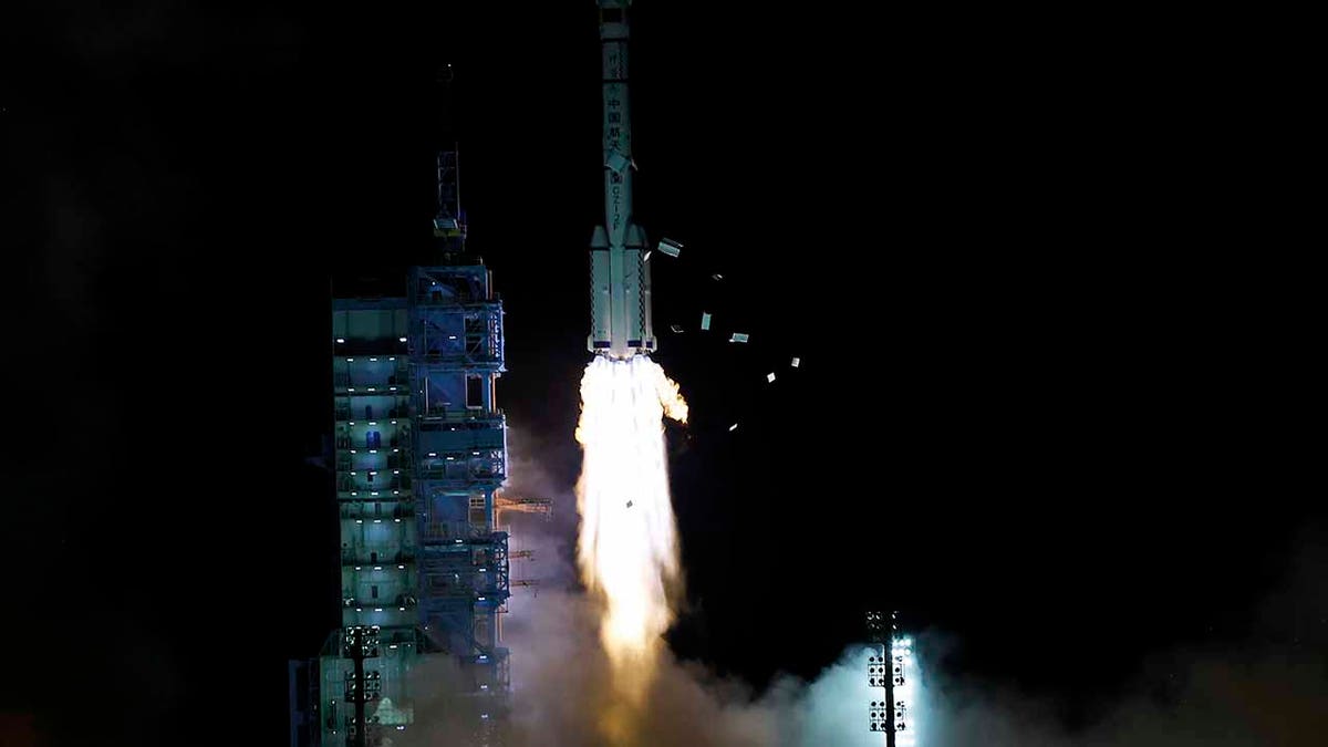 The crewed spaceship Shenzhou-13, atop a Long March-2F carrier rocket, is launched from the Jiuquan Satellite Launch Center in northwest China's Gobi Desert, Oct. 16, 2021.