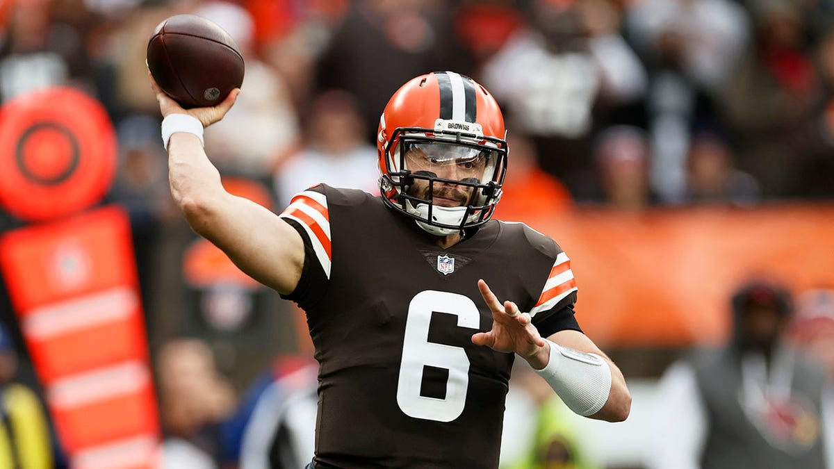Cleveland Browns quarterback Baker Mayfield throws during the first half against the Arizona Cardinals, Sunday, Oct. 17, 2021, in Cleveland. 