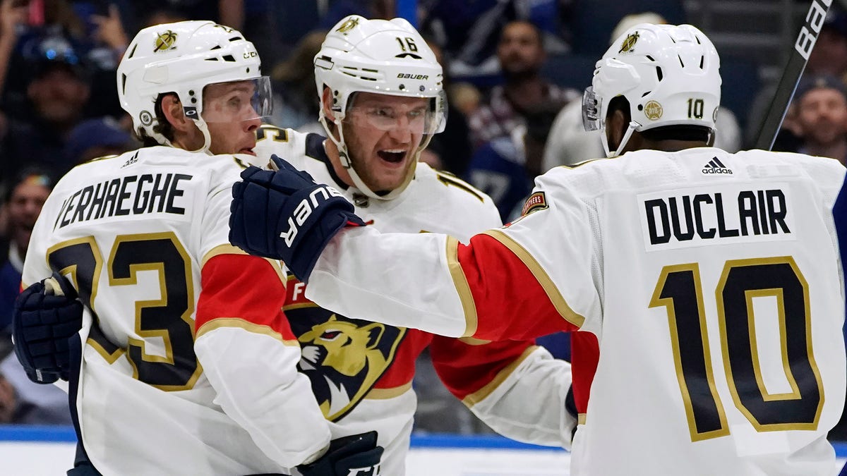 Florida Panthers center Aleksander Barkov (16) celebrates his goal against the Tampa Bay Lightning with left wing Carter Verhaeghe (23) and left wing Anthony Duclair (10) during the third period of an NHL hockey game Tuesday, Oct. 19, 2021, in Tampa, Fla.