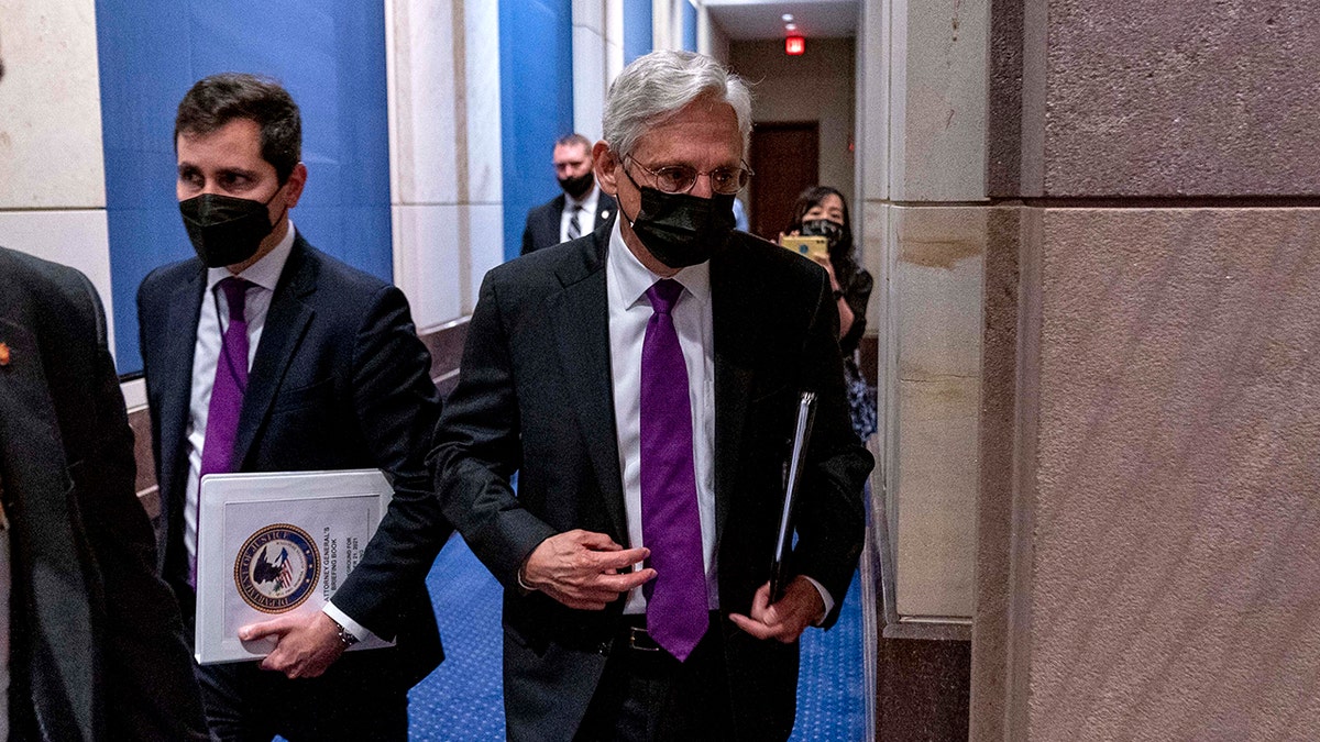 Attorney General Merrick Garland returns following a brief recess of a House Judiciary Committee oversight hearing of the Department of Justice on Capitol Hill in Washington, Thursday, Oct. 21, 2021. (AP Photo/Andrew Harnik)