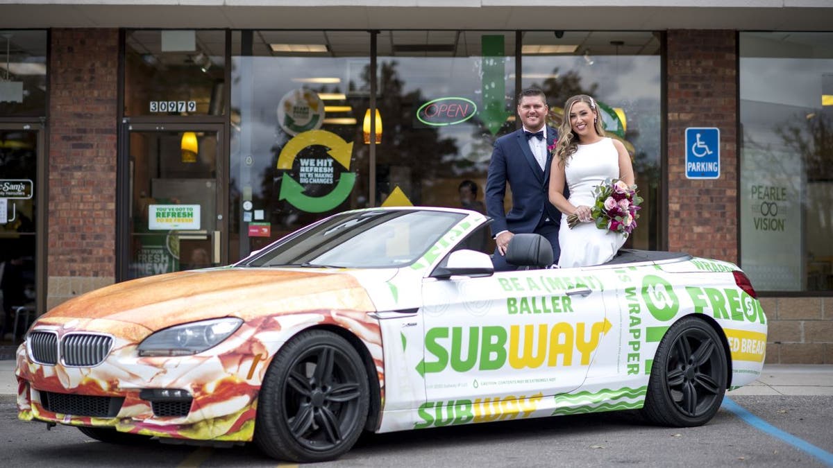 Newlyweds Julie Bushart and Zack Williams got to "Eat Fresh" and snap a few photos at the Subway where they first met.