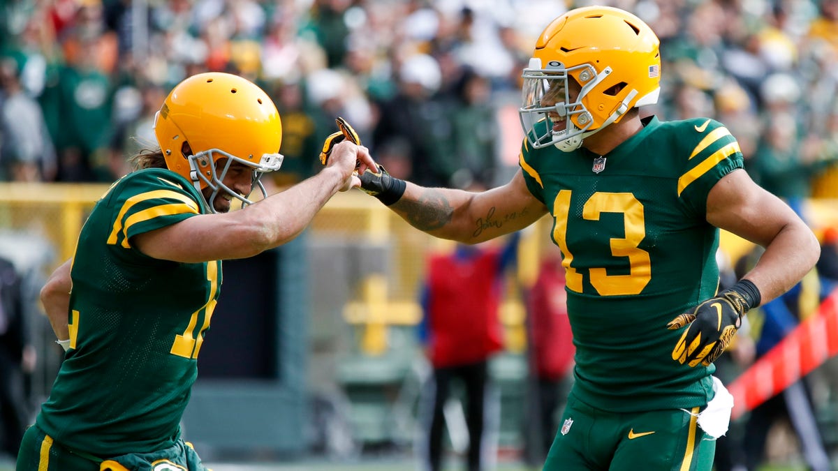 Green Bay Packers' Allen Lazard celebrates his touchdown catch with Aaron Rodgers during the first half of an NFL football game against the Washington Football Team Sunday, Oct. 24, 2021, in Green Bay, Wisconsin.
