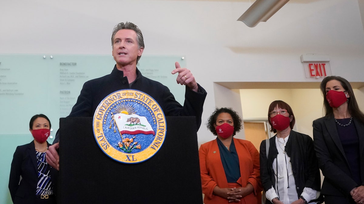 Gov. Gavin Newsom speaking at a news conference after receiving a Moderna COVID-19 vaccine booster shot in Oakland, Calif., on Oct. 27, 2021.