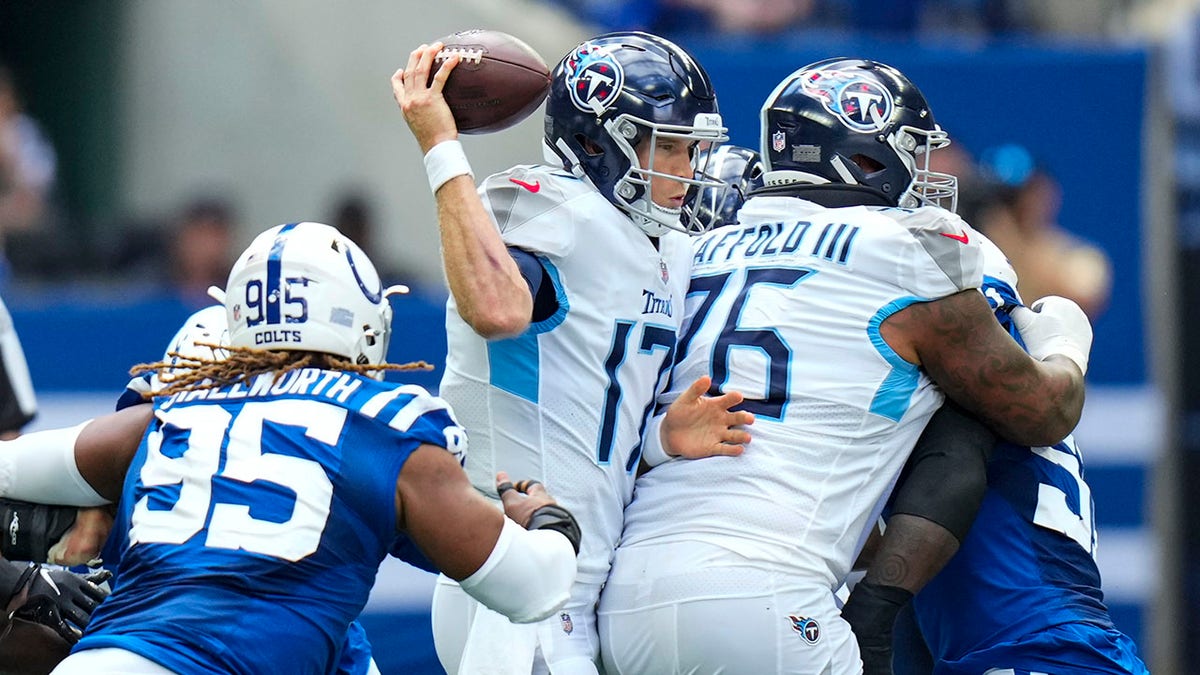 Tennessee Titans quarterback Ryan Tannehill (17) is sacked by Indianapolis Colts defensive tackle Taylor Stallworth (95) in the first half of an NFL football game in Indianapolis, Sunday, Oct. 31, 2021.