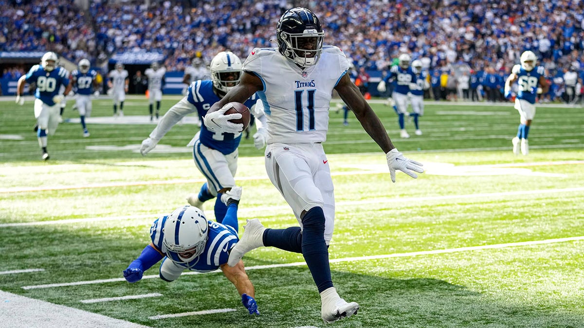 Tennessee Titans wide receiver A.J. Brown (11) heads to the end zone for a touchdown against the Indianapolis Colts in the first half of an NFL football game in Indianapolis, Sunday, Oct. 31, 2021. (AP Photo/AJ Mast)
