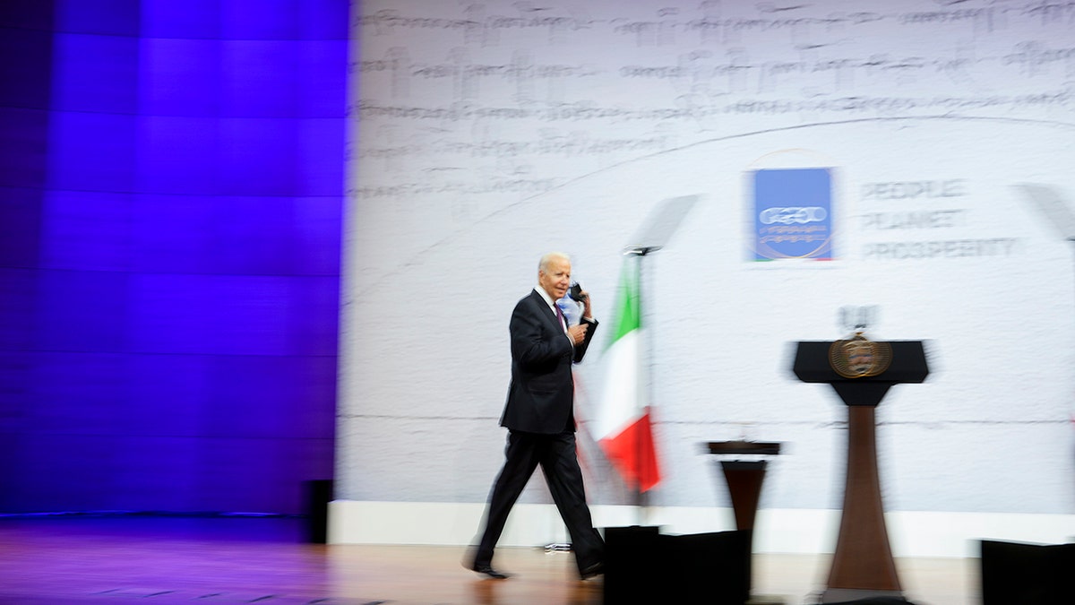 U.S. President Joe Biden arrives for a press conference at the La Nuvola conference center for the G20 summit in Rome, Sunday, Oct. 31, 2021. Leaders of the world's biggest economies made a compromise commitment Sunday to reach carbon neutrality "by or around mid-century" as they wrapped up a two-day summit that was laying the groundwork for the U.N. climate conference in Glasgow, Scotland. (AP Photo/Andrew Medichini)