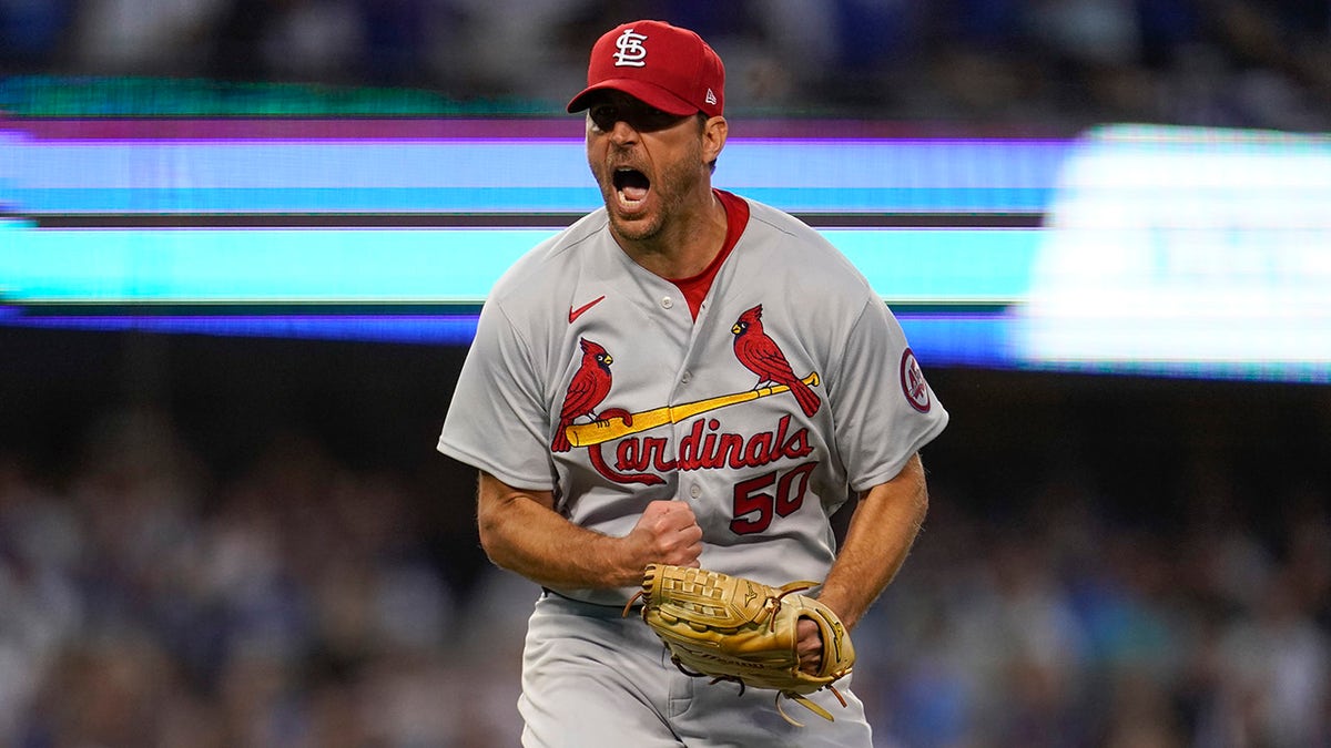 St. Louis Cardinals starting pitcher Adam Wainwright reacts after Los Angeles Dodgers' Trea Turner grounds out in to a double play during the third inning of a National League Wild Card playoff baseball game Wednesday, Oct. 6, 2021, in Los Angeles.