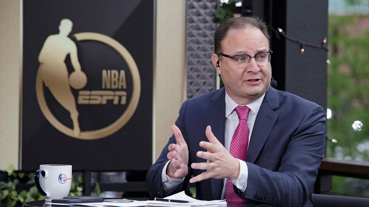 MILWAUKEE, WI - JULY 11: ESPN Analyst, Adrian Wojnarowski, talks before the game between the Phoenix Suns and Milwaukee Bucks during Game Three of the 2021 NBA Finals on July 11, 2021 at the Fiserv Forum Center in Milwaukee, Wisconsin.