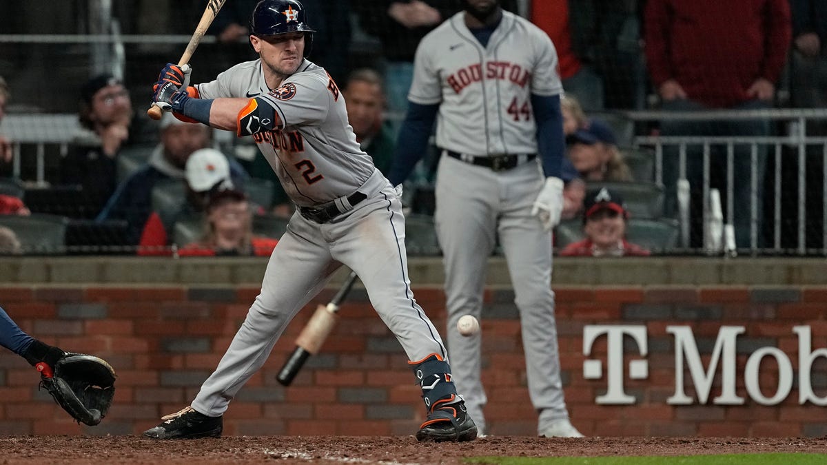 Houston Astros' Alex Bregman gets hit by pitch during the sixth inning in Game 3 of baseball's World Series between the Houston Astros and the Atlanta Braves on Friday, Oct. 29, 2021, in Atlanta. 