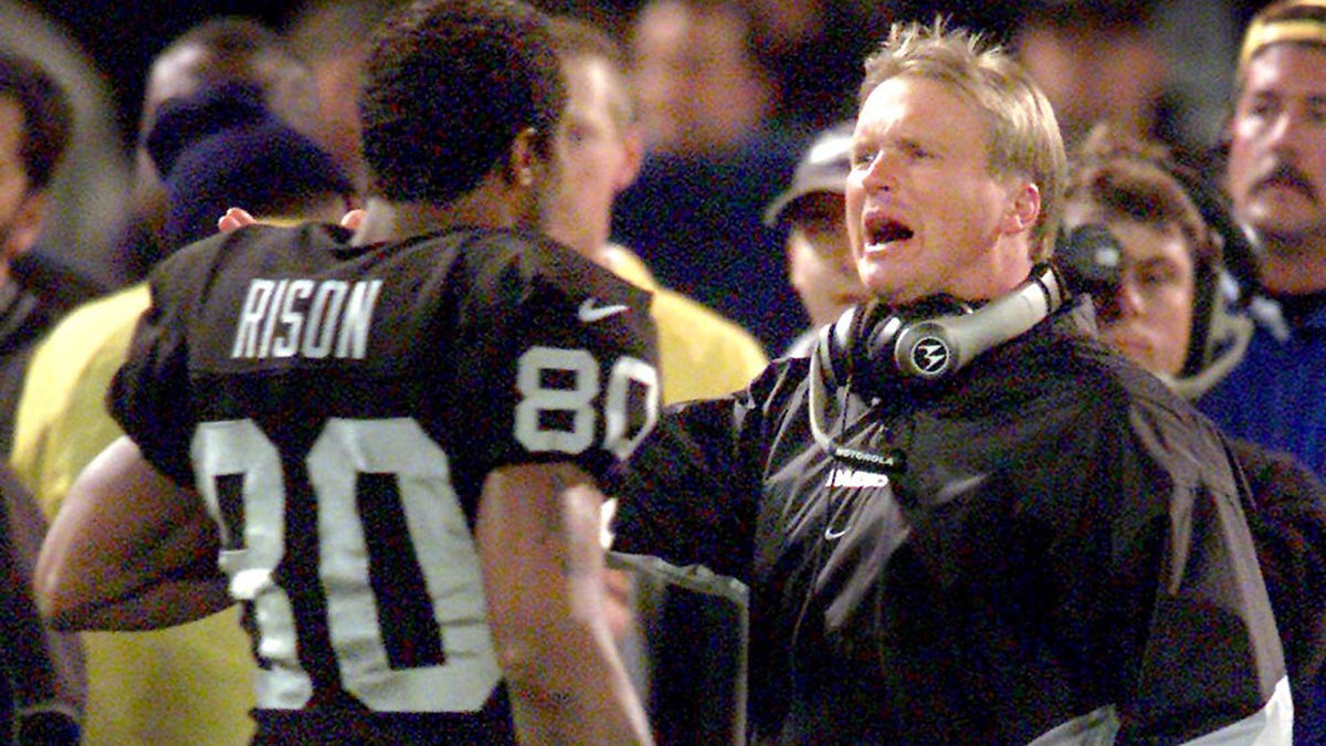 Oakland, CA December 10, 2000: Raiders coach Jon Gruden talks with Andre Rison during a rout of the Jets.