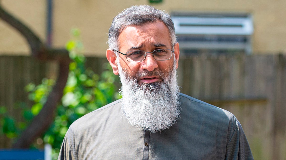 Anjem Choudary. Amends spelling of Choudary in filename. Radical preacher Anjem Choudary speaks to the media in Ilford, east London, after restrictions on him speaking in public following his release from prison came to an end. Picture date: Monday July 19, 2021. The extremist was jailed five years ago after being convicted of inviting support for the Islamic State terror group, and he left Belmarsh high-security jail on licence in 2018. Photo credit should read: Dominic Lipinski/PA Wire URN:61031998 (Press Association via AP Images)