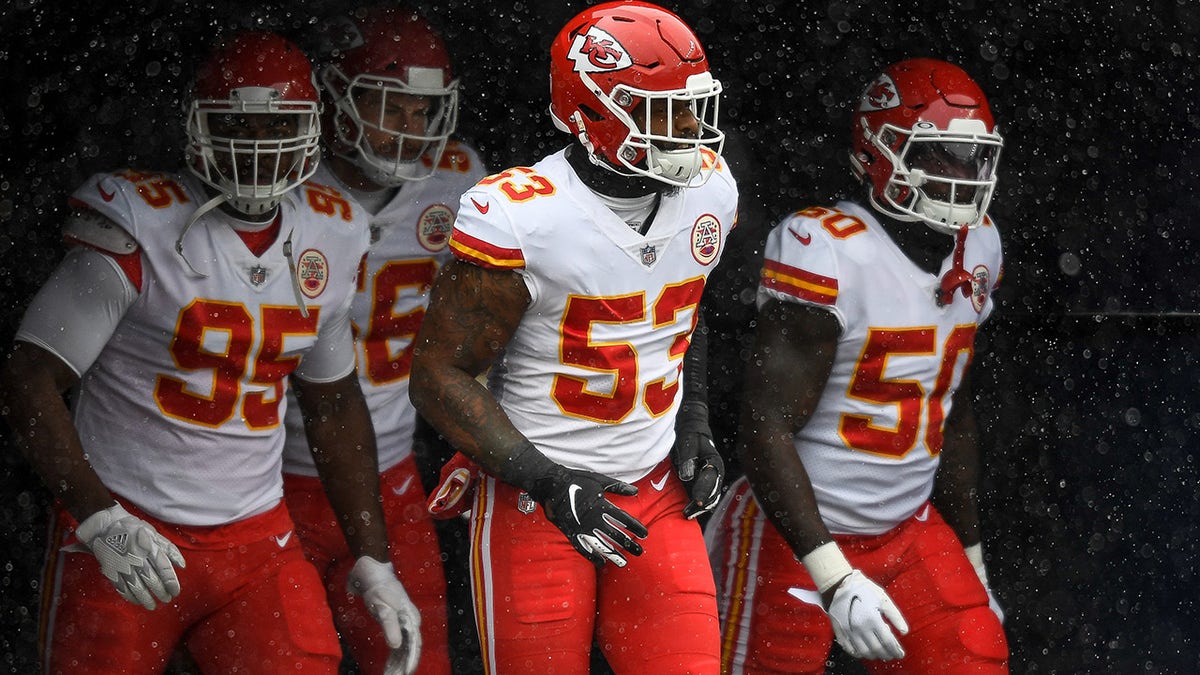 DENVER, CO - OCTOBER 25: Kansas City Chiefs player run onto the field to warm up behind Anthony Hitchens #53 before a game against the Denver Broncos at Empower Field at Mile High on October 25, 2020 in Denver, Colorado.