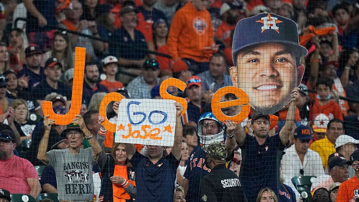 Spectators cheer for Houston Astros second baseman Jose Altuve during the first inning in Game 1 of a baseball American League Division Series between the Houston Astros and the Chicago White Sox Thursday, Oct. 7, 2021, in Houston.