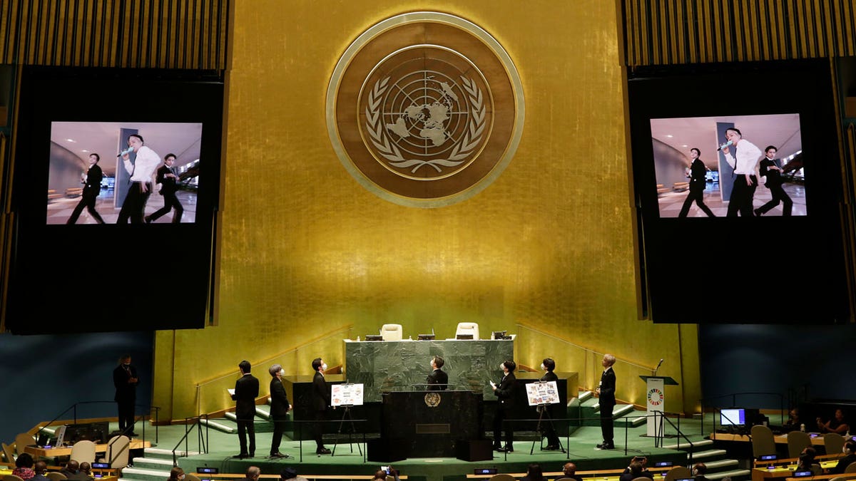 Members of South Korean K-pop band BTS watch a music video on the General Assembly Hall monitors during a meeting on Sustainable Development Goals at the 76th session of the U.N. General Assembly at U.N. headquarters on Monday, Sept. 20, 2021. (John Angelillo/Pool Photo via AP)