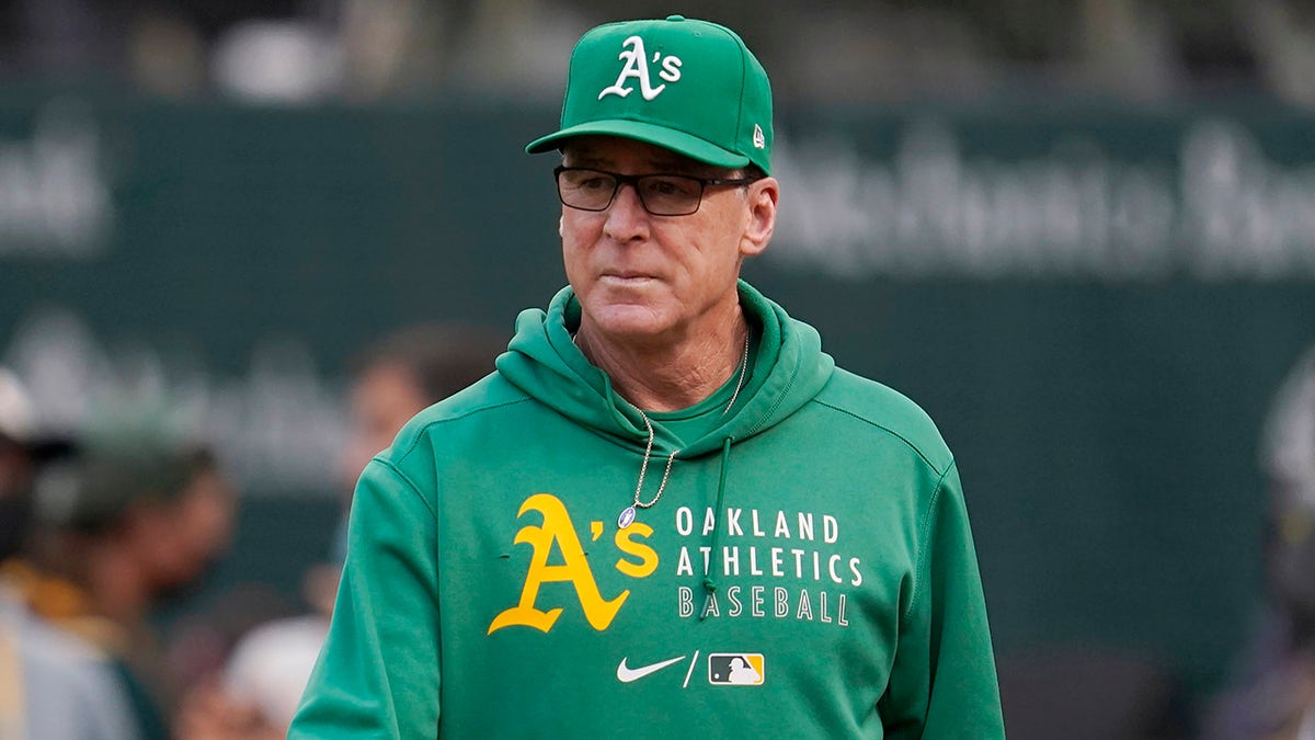 FILE - In this Aug. 20, 2021, file photo, Oakland Athletics manager Bob Melvin walks on the field before the team's baseball game against the San Francisco Giants in Oakland, Calif.