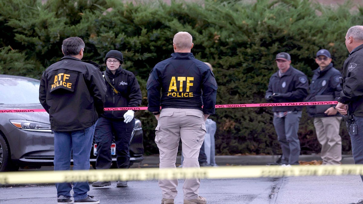 Law enforcement officers collect evidence near the scene of a shooting at the Boise Towne Square shopping mall in Boise, Idaho, U.S., October 25, 2021. REUTERS/Shannon Stapleton
