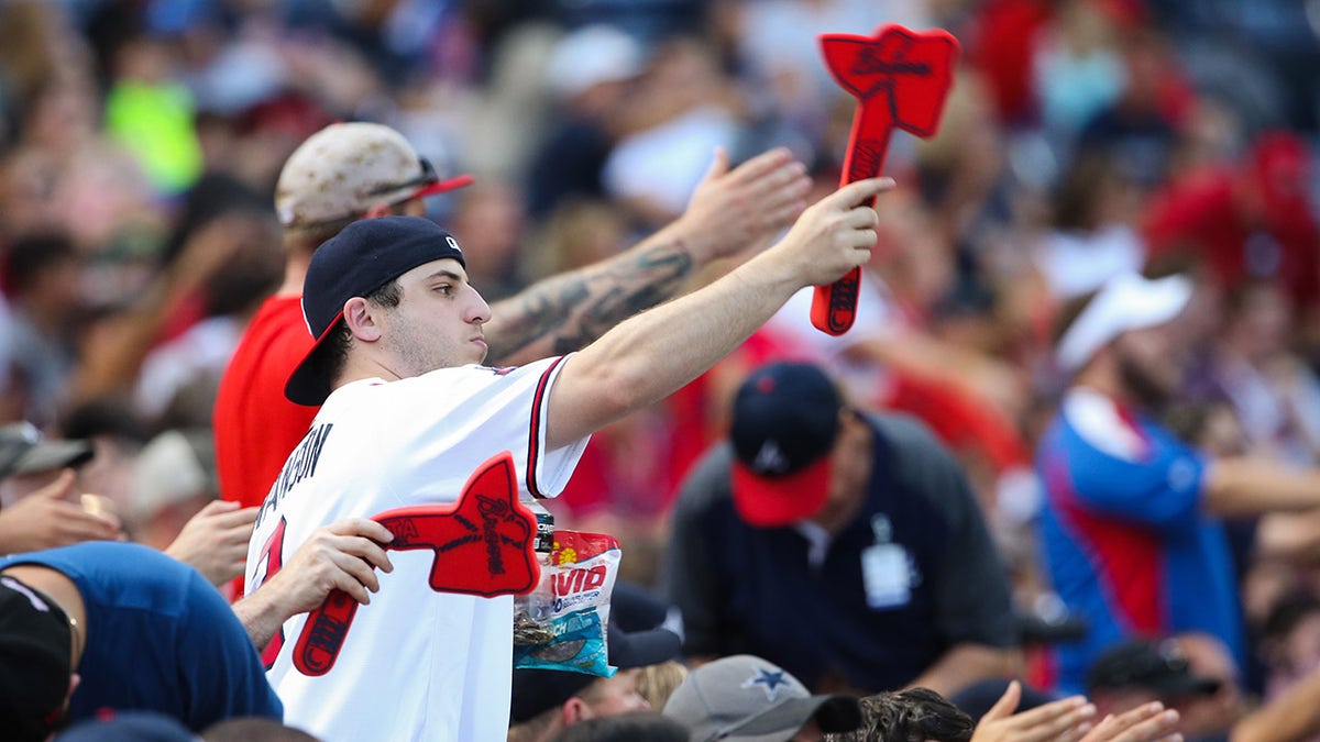 Atlanta Braves fans performing the tomahawk chop
