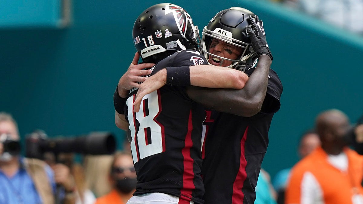 Atlanta Falcons wide receiver Calvin Ridley (18) celebrates scoring a touchdown with Atlanta Falcons quarterback Matt Ryan (2), during the first half of an NFL football game against the Miami Dolphins, Sunday, Oct. 24, 2021, in Miami Gardens, Fla.