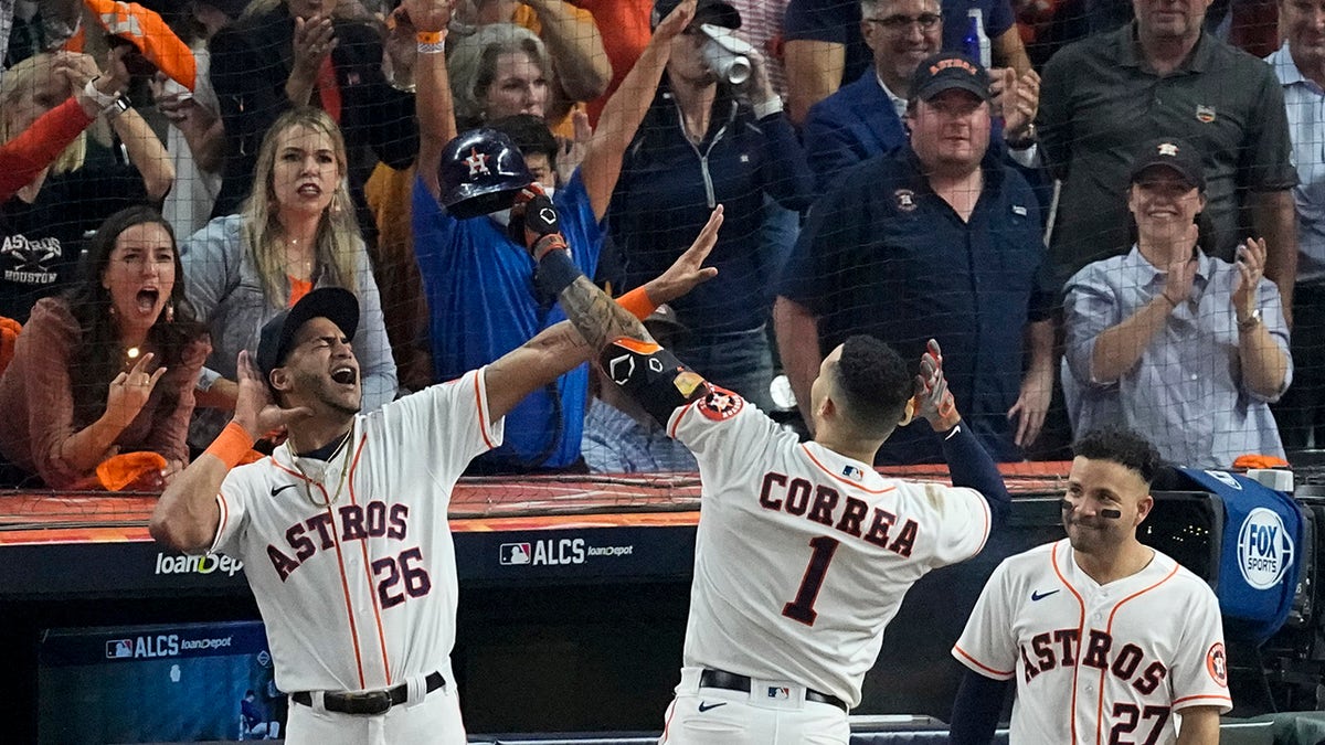 The Houston Astros' Carlos Correa celebrates a home run against the Boston Red Sox during the seventh inning in Game 1 of baseball's American League Championship Series Friday, Oct. 15, 2021, in Houston.