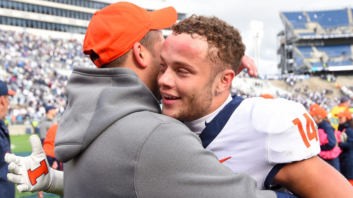 Oct 23, 2021; University Park, Pennsylvania, USA; Illinois Fighting Illini wide receiver Casey Washington (right) celebrates following the game against the Penn State Nittany Lions at Beaver Stadium.