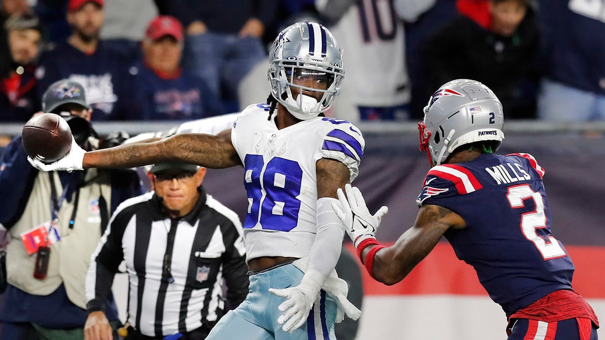 Dallas Cowboys wide receiver CeeDee Lamb stretches the ball over the goal line for the game-winning touchdown against the New England Patriots on Sunday, Oct. 17, 2021, in Foxborough, Massachusetts.