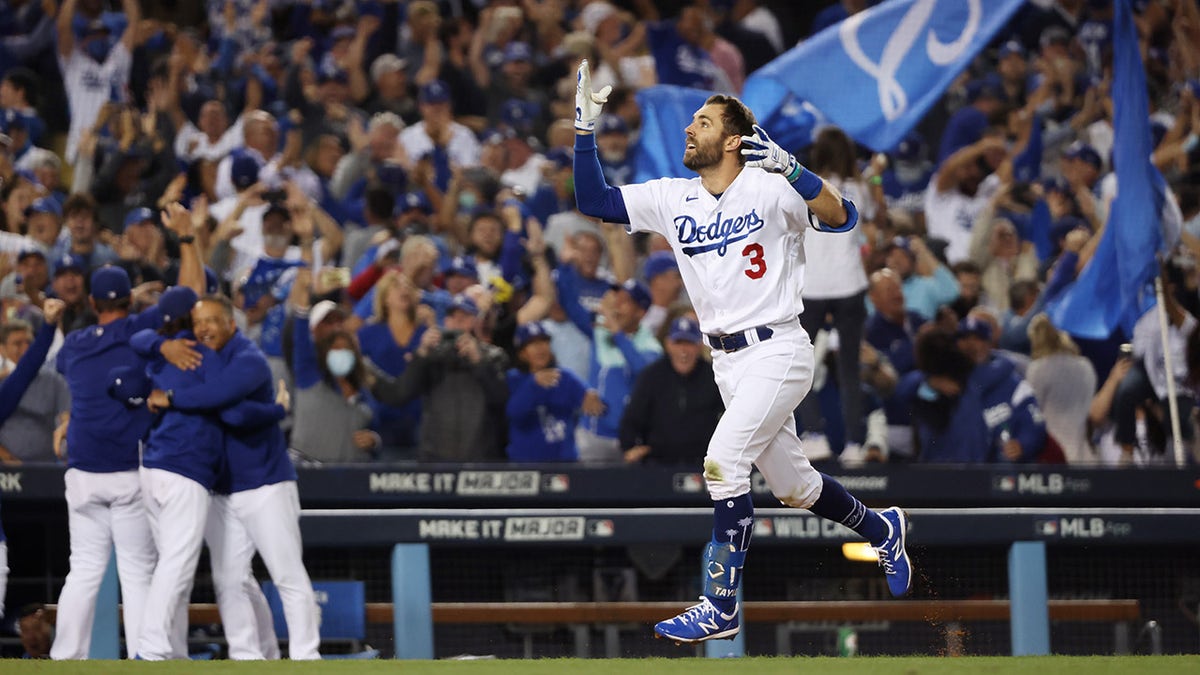 Chris Taylor #3 of the Los Angeles Dodgers celebrates his walk off two-run home run in the ninth inning to defeat the St. Louis Cardinals 3 to 1 during the National League Wild Card Game at Dodger Stadium on October 06, 2021 in Los Angeles, California.