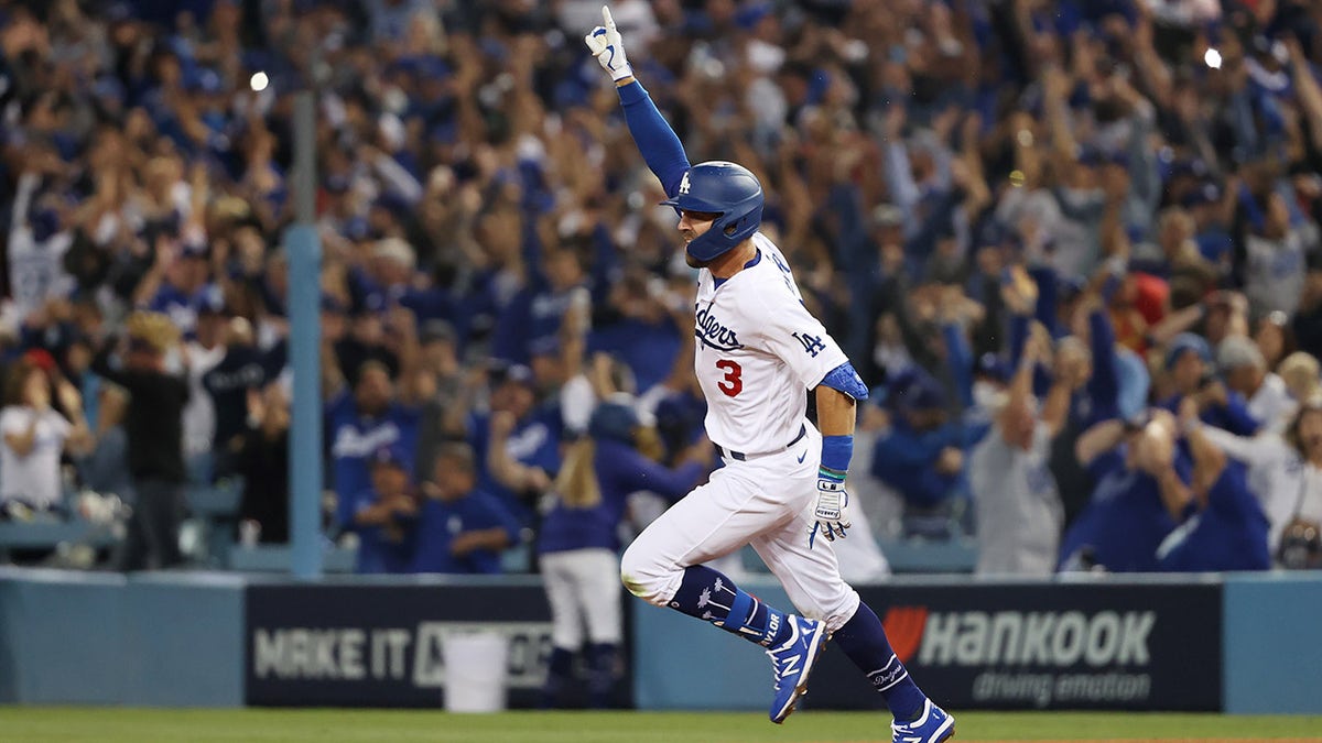 Chris Taylor #3 of the Los Angeles Dodgers celebrates his walk off two-run home run in the ninth inning to defeat the St. Louis Cardinals 3 to 1 during the National League Wild Card Game at Dodger Stadium on October 06, 2021 in Los Angeles, California.