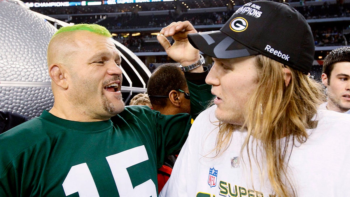 Mixed martial arts fighter Chuck Liddell (L) chats with Green Bay Packers' linebacker Clay Matthews after the Packers defeated the Pittsburgh Steelers, 31-25, in the NFL's Super Bowl XLV football game in Arlington, Texas, February 6, 2011.