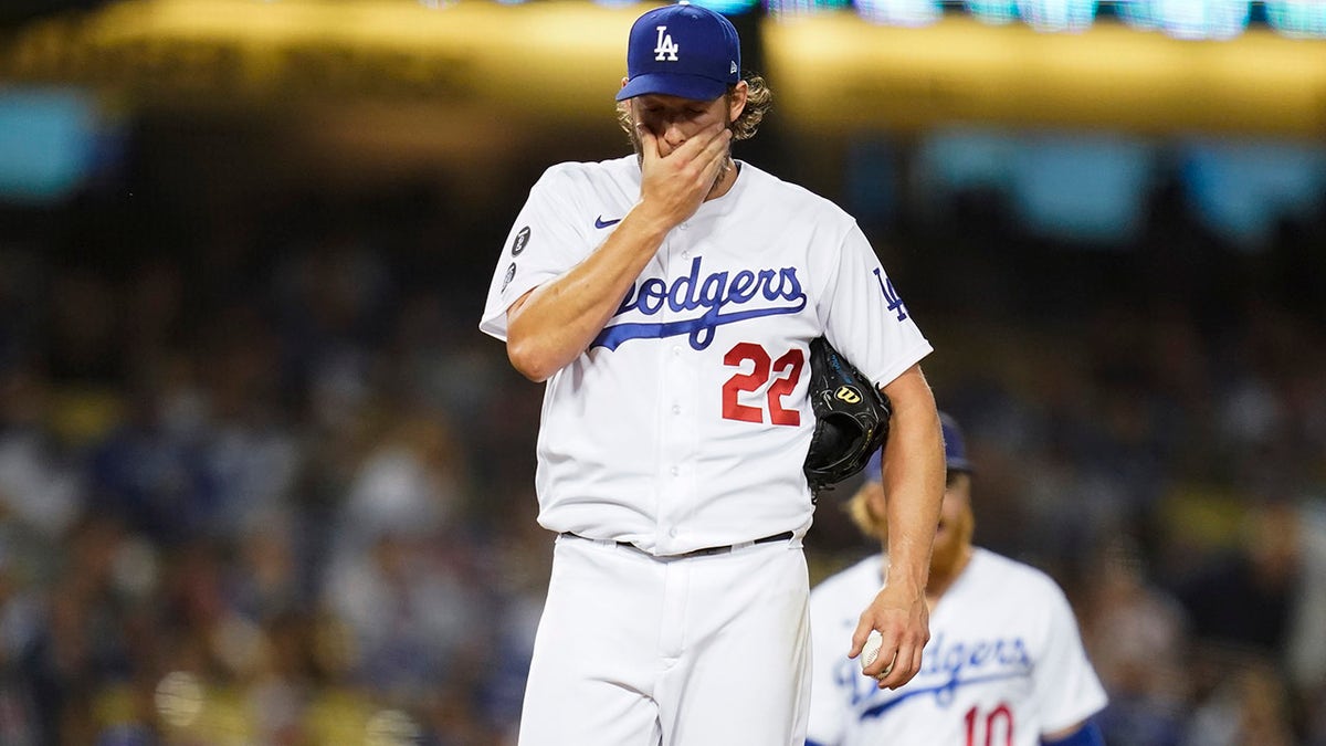 Los Angeles Dodgers starting pitcher Clayton Kershaw (22) reacts on the mound before he exits the game during the second inning of a baseball game against the Milwaukee Brewers Friday, Oct. 1, 2021, in Los Angeles.