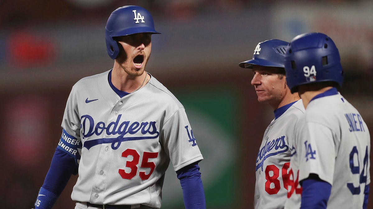 Los Angeles Dodgers' Cody Bellinger reacts after hitting an RBI single against the San Francisco Giants during the ninth inning of Game 5 of a baseball National League Division Series Thursday, Oct. 14, 2021, in San Francisco.