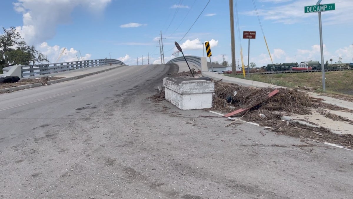 A coffin displaced after Hurricane Ida sits on the road outside Jean Lafitte, Louisiana.