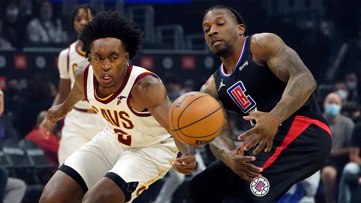 Cleveland Cavaliers guard Collin Sexton, left, steals the ball from Los Angeles Clippers guard Eric Bledsoe during the first half of an NBA basketball game Wednesday, Oct. 27, 2021, in Los Angeles.