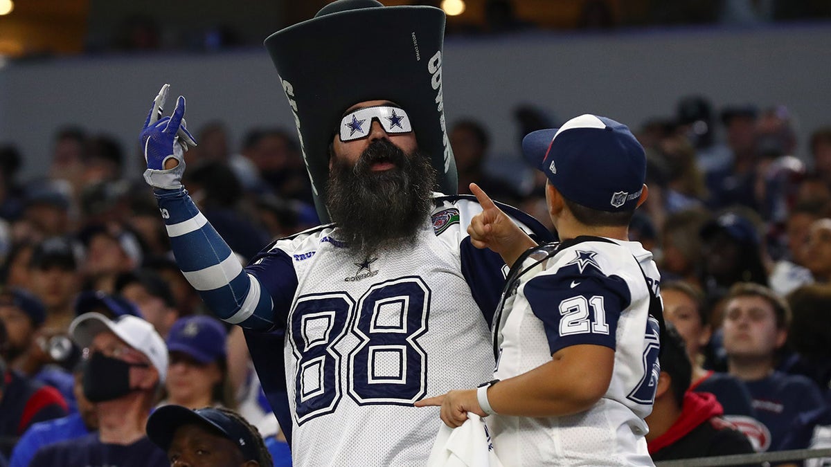 Dallas Cowboys fan cheers during the first half against the Houston Texans at AT&amp;T Stadium.
